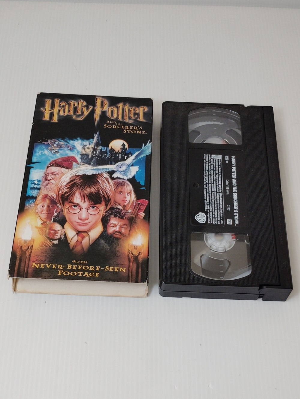 12 For $8 Warner Bros. VHS with Colorful Harry Potter Cover Art - Black Cassette